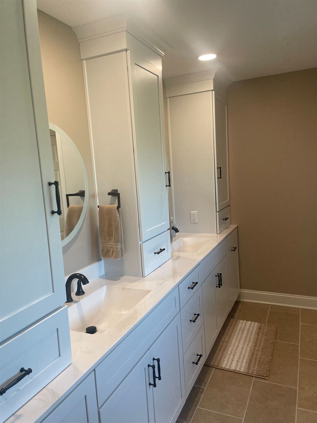Double vanity with tower cabinets by Stellar Construction
