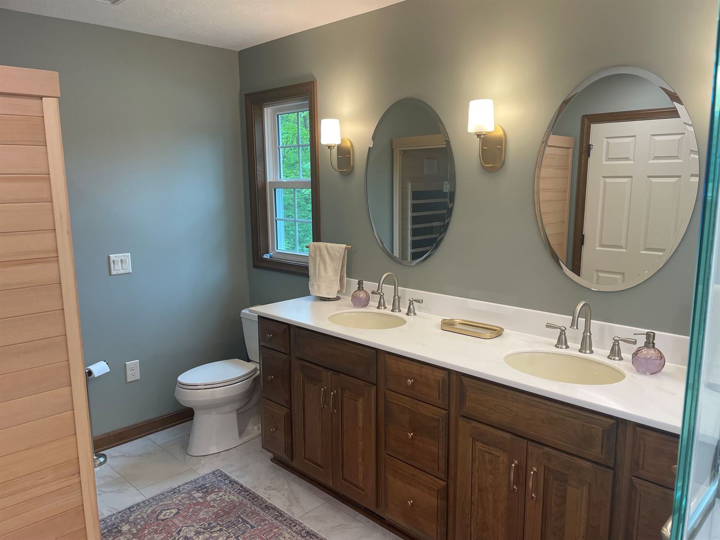 Master bath remodel with double vanity by Stellar Construction