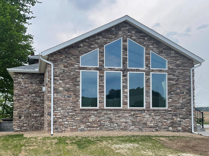 Great room addition with prow window wall by Stellar Construction